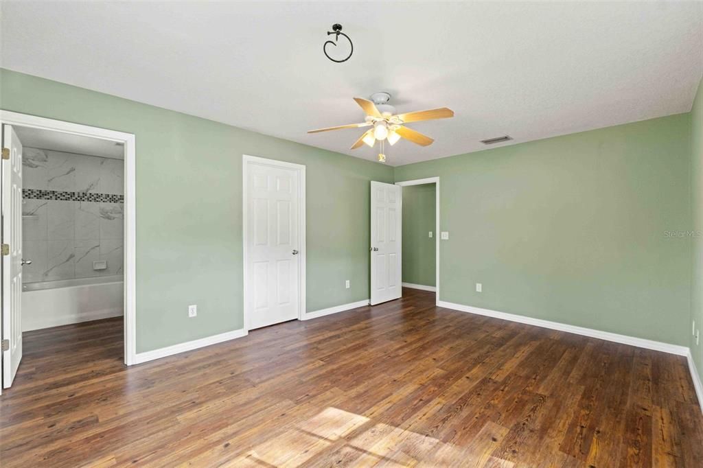 Primary bedroom with en suite bath and walk in closet