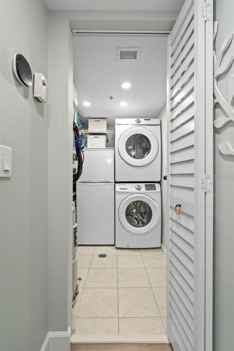 Stackable washer/dryer and spare fridge.  Extra shelves for storage