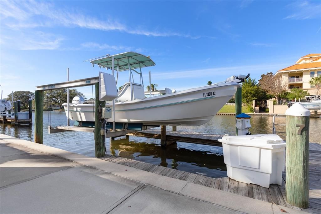 Boat slip with 10,000 lb boat lift, electric and water, and fiberglass dock box available separately.