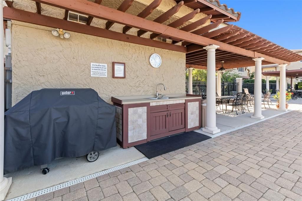 Amenities include grill, outdoor kitchen