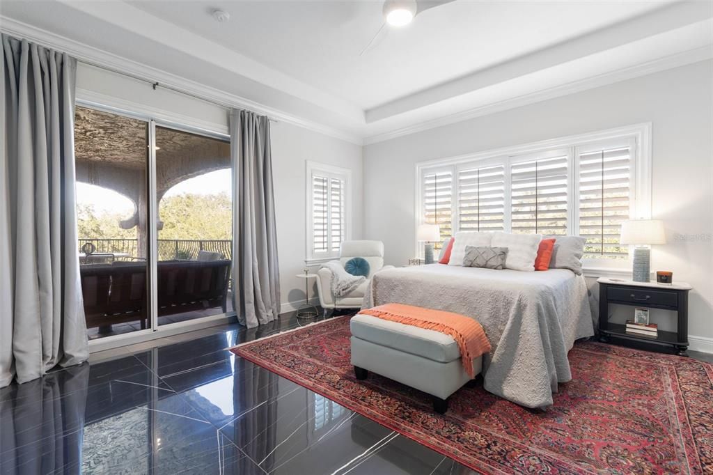 Primary Bedroom with sliding glass doors out to covered balcony