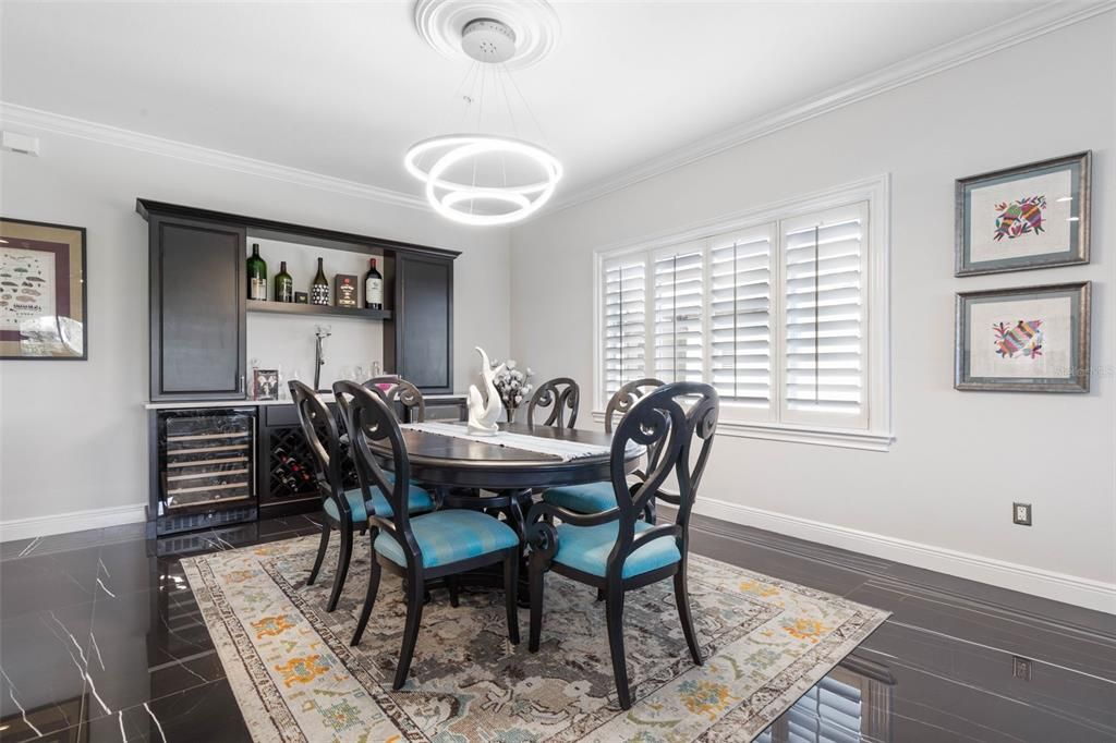 Dining area with a custom built bar and storage