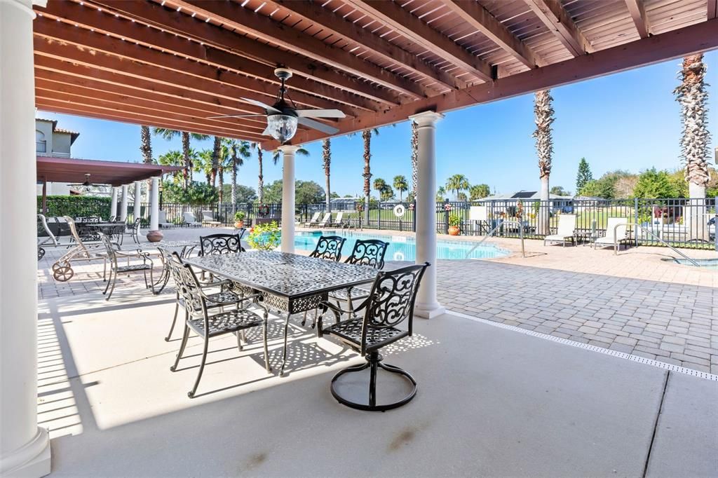 Covered dining area by community pool