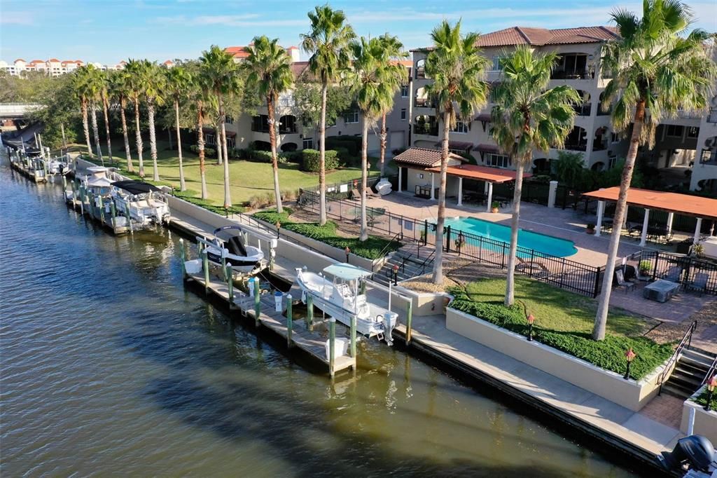 Boat slip with 10,000 lb boat lift, electric and water, and fiberglass dock box available separately.