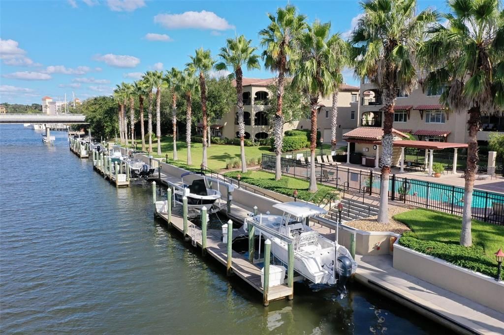 Boat slip with 10,000 lb boat lift, electric and water, and fiberglass dock box available separately.