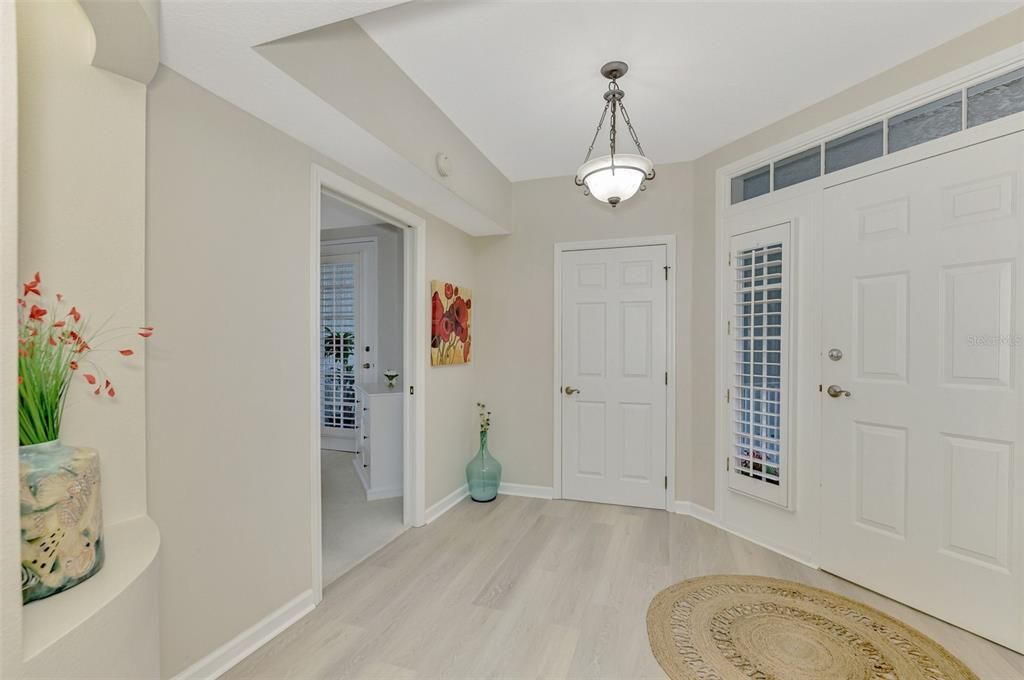 A welcoming front entry with new luxury vinyl plank flooring throughout the living areas.