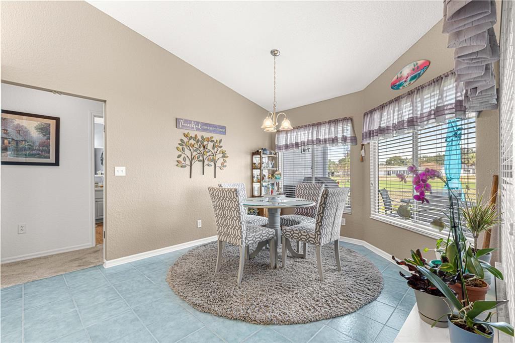 eat in kitchen with bay window view of golf course