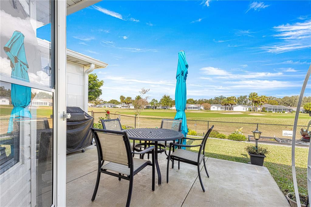 back porch/patio with umbrella for shade