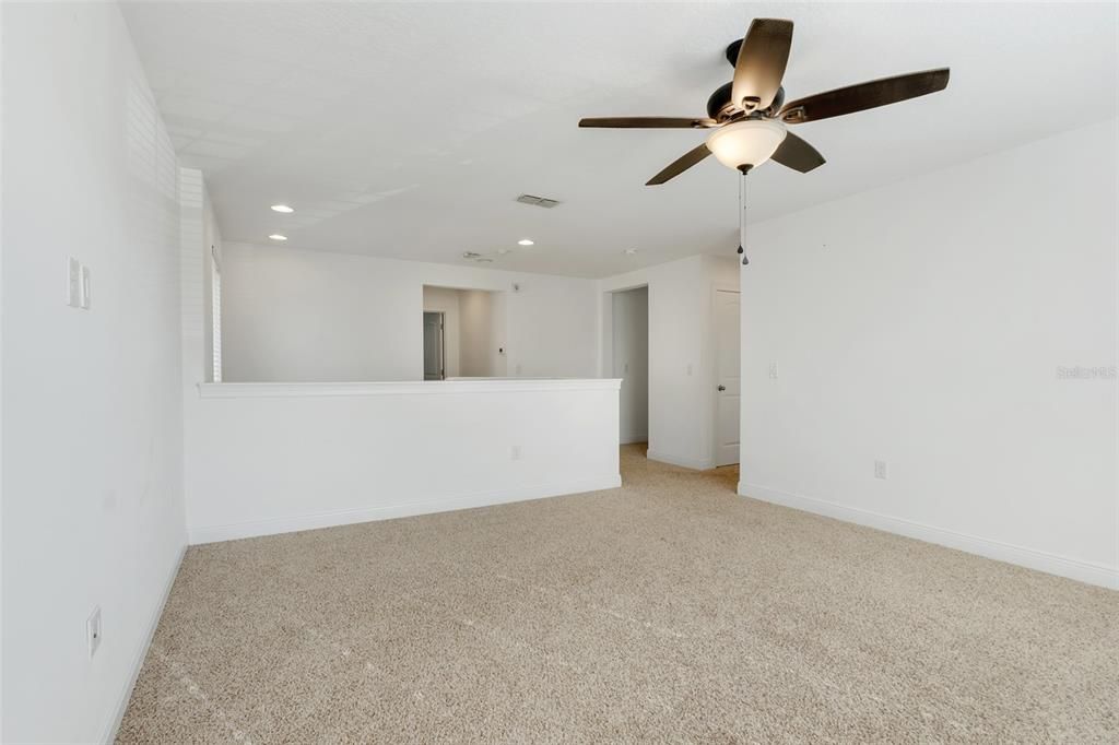 2nd Master Bedroom Upstairs with view to the bathroom