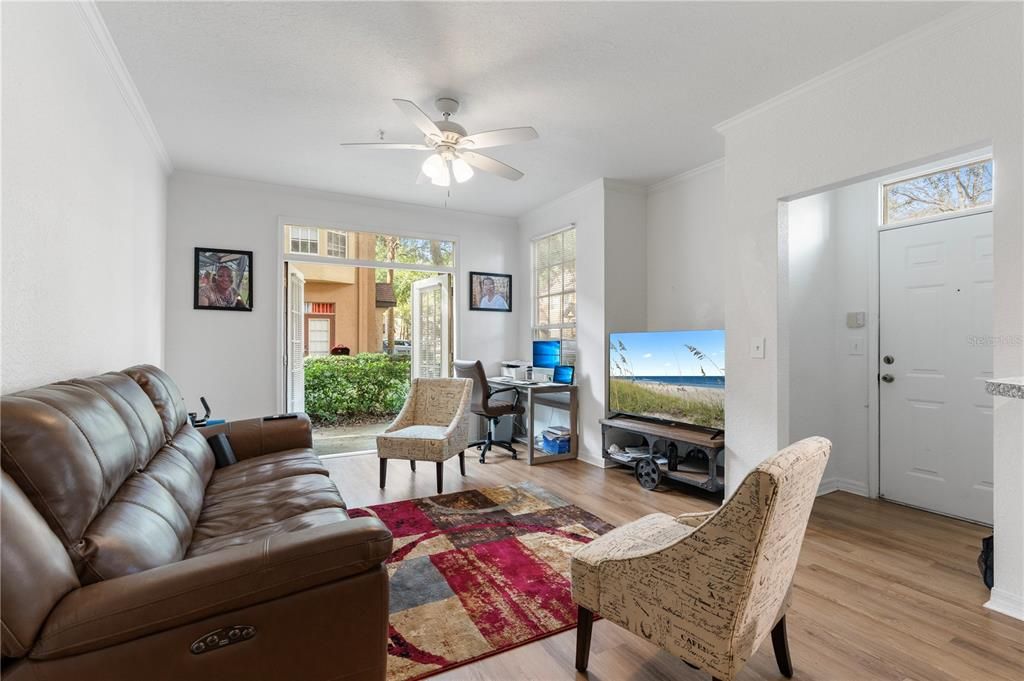 Quaint French doors lead to the open patio that is ideal for a cookout or to enjoy your favorite morning beverage or afternoon libation after a long day.