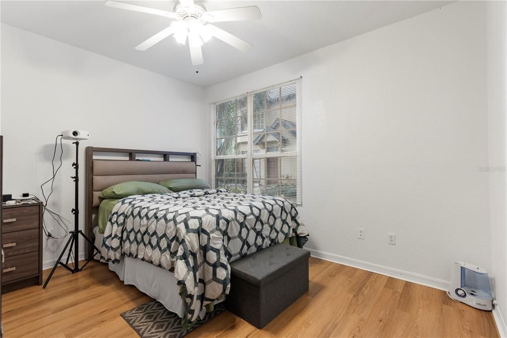 Master bedroom with upgraded laminate wood floors