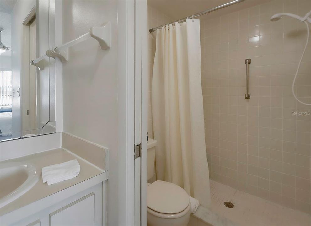 Ensuite bath has a roomy shower.