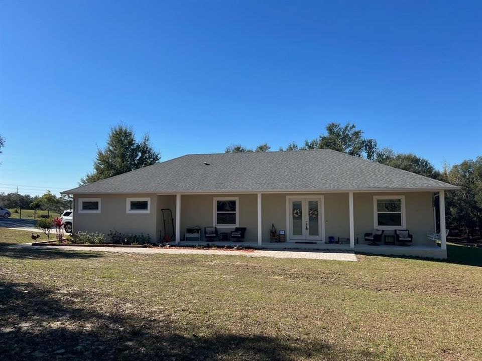 Front view showing large covered front porch