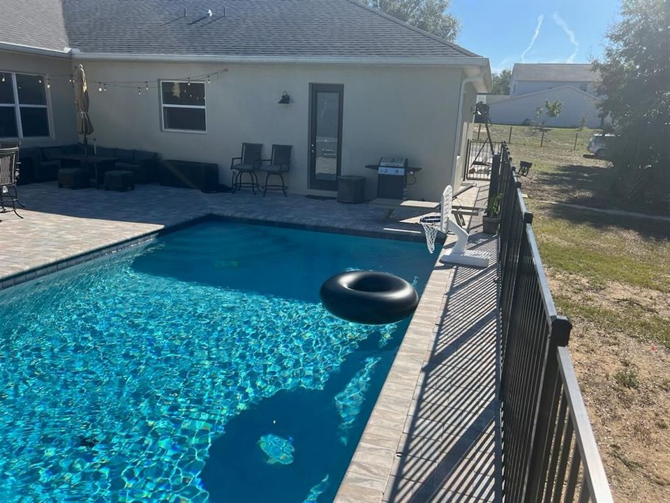 Fully fenced in pool deck area