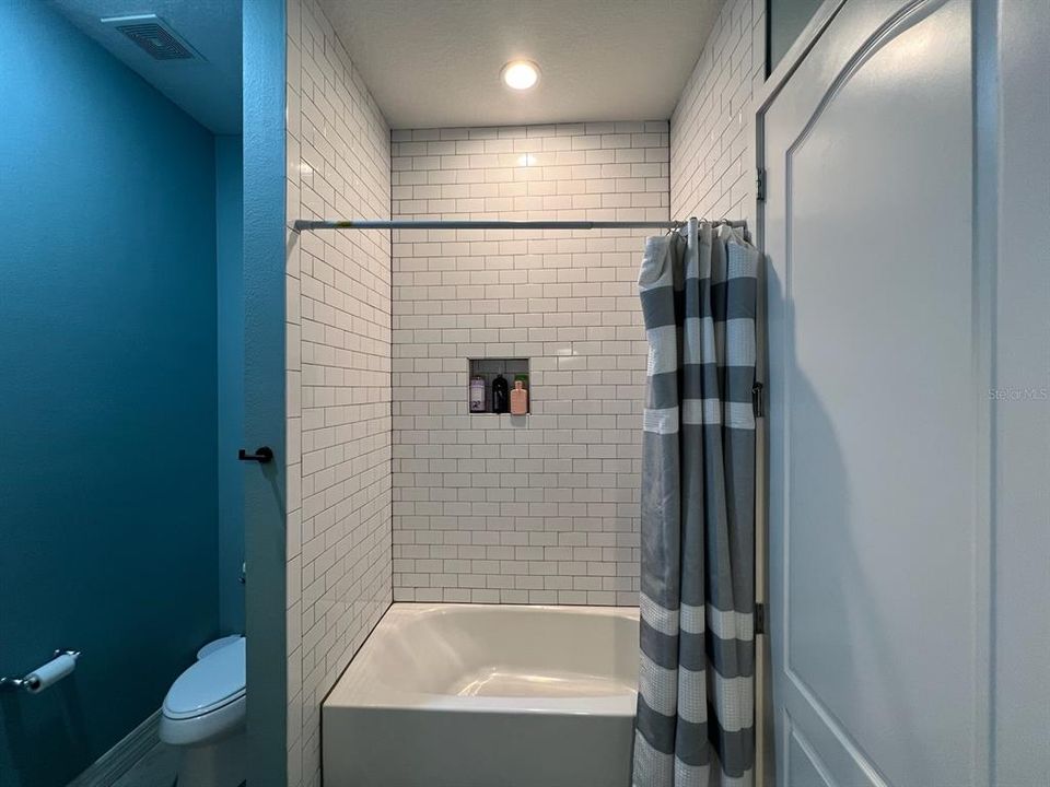 Guest bathroom tub and shower