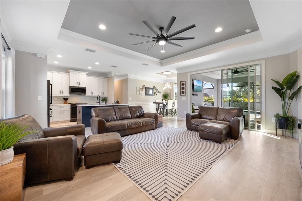 View from Front Entrance. Florida Style Home, Open Floor Plan, LVP upgraded Flooring-Opens to Covered Lanai & Pool.