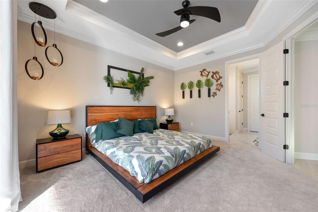 View of Primary bath featuring walk-in closet, private toilet room and large linen closet.