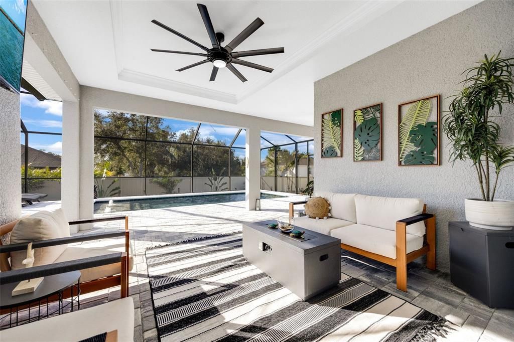 This is your outdoor family room! The extensive covered lanai allows you to enjoy the outdoors in all elements! Hurrican shutters are on the lanai walls - NOT on the doors. Everything was completed thoughtfully.