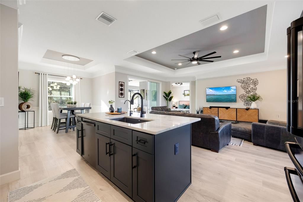 Kitchen has upgraded Cabinets, Dual color Island, Marble Counters, Upgraded Handles & Faucets, Added Fans & Light Fixtures & extra Recessed Lighting.