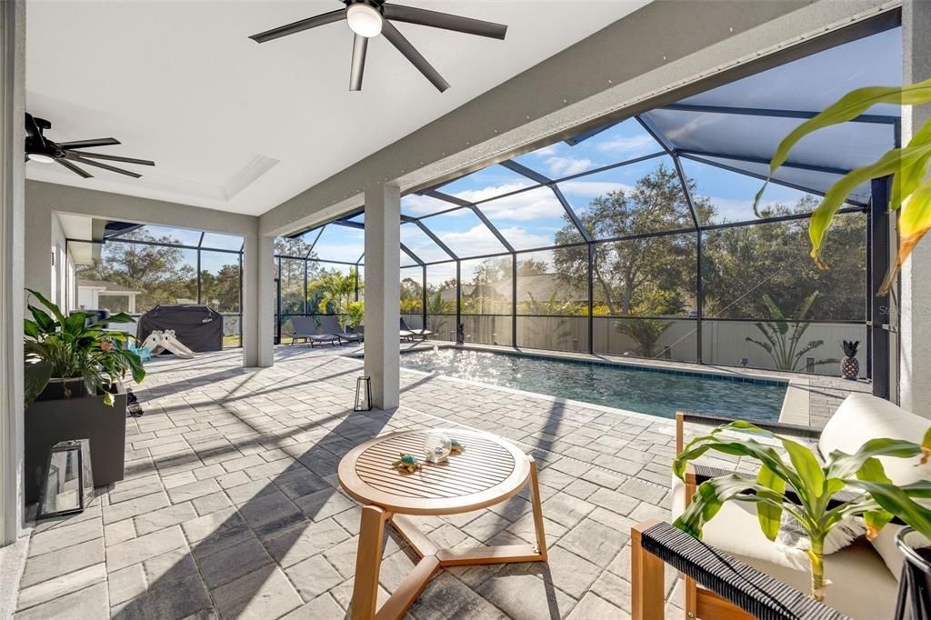 View of enlarged covered lanai space, along with extended pool deck for those sunny days!