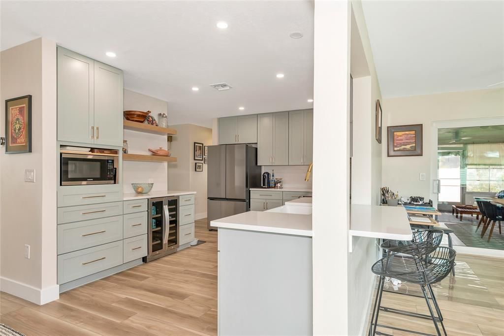 Kitchen pass through into family room / counter with bar stools