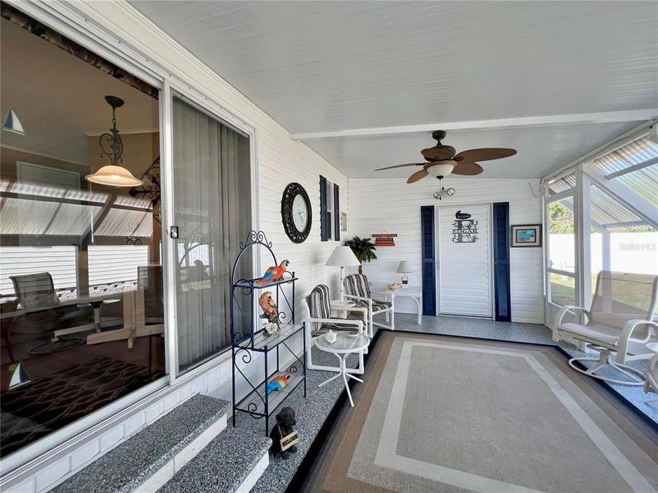 Enclosed screen patio under carport