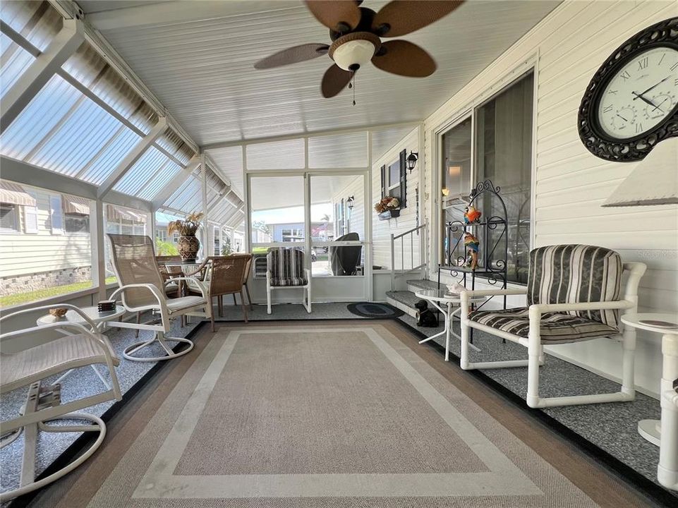 Enclosed screen patio under carport