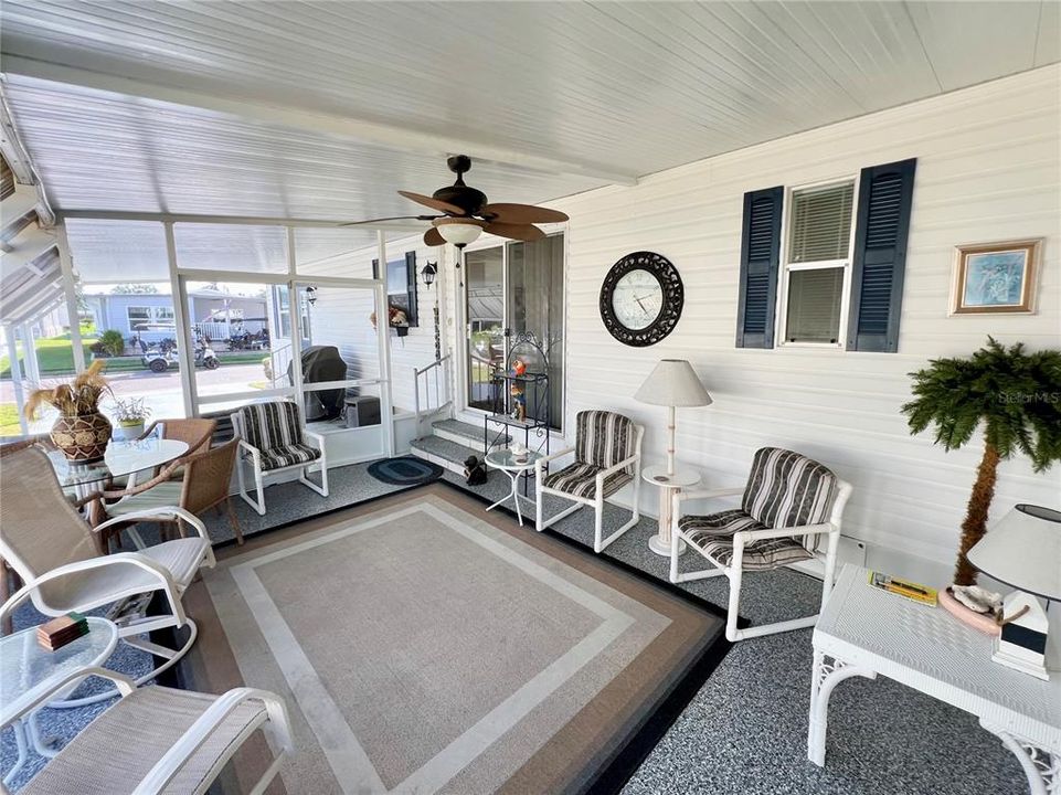 Enclosed screen patio under carport