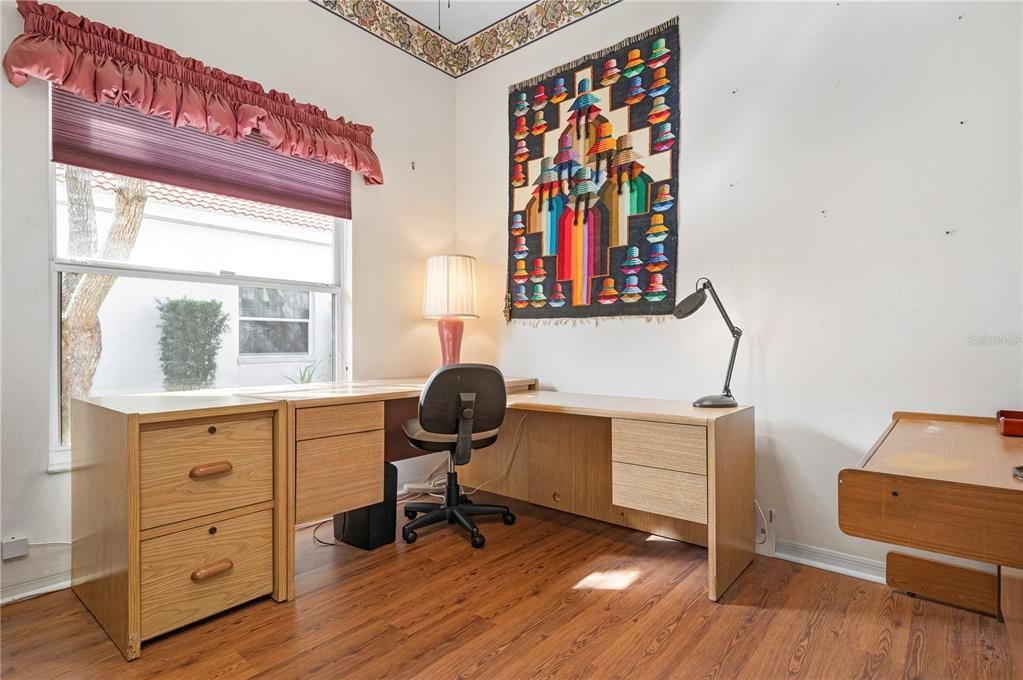 Bedroom 3 with new flooring and desk