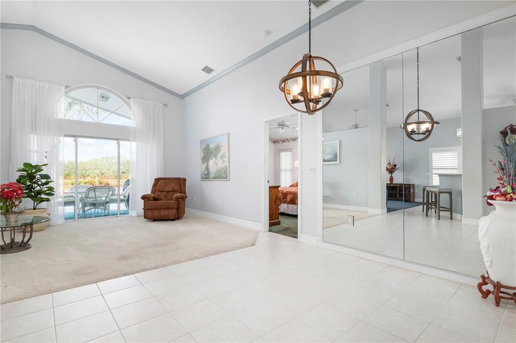 Formal living room with entrance to master bedroom