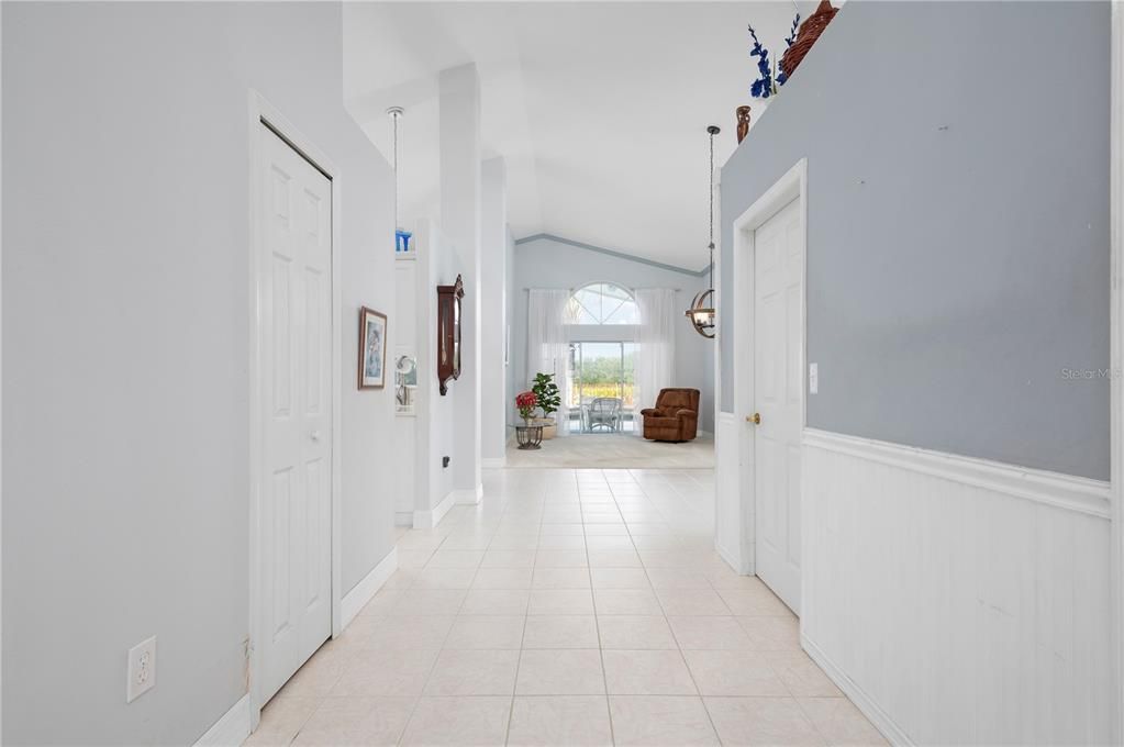 Interior front hall leading to formal living room and pool