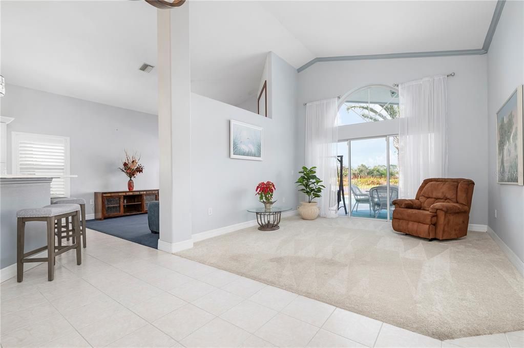 Formal living room with view to family room