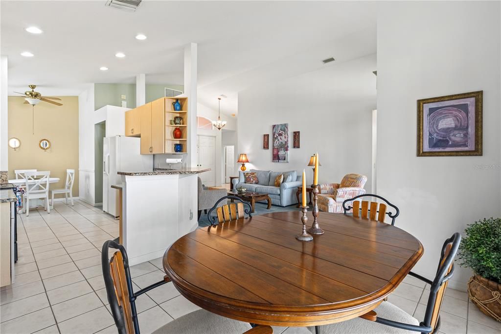 Dining room area off of kitchen also looks into living room