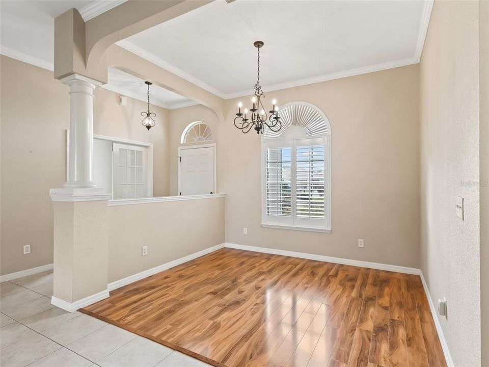 Dining area w/Crown, Upgraded chandelier & laminate