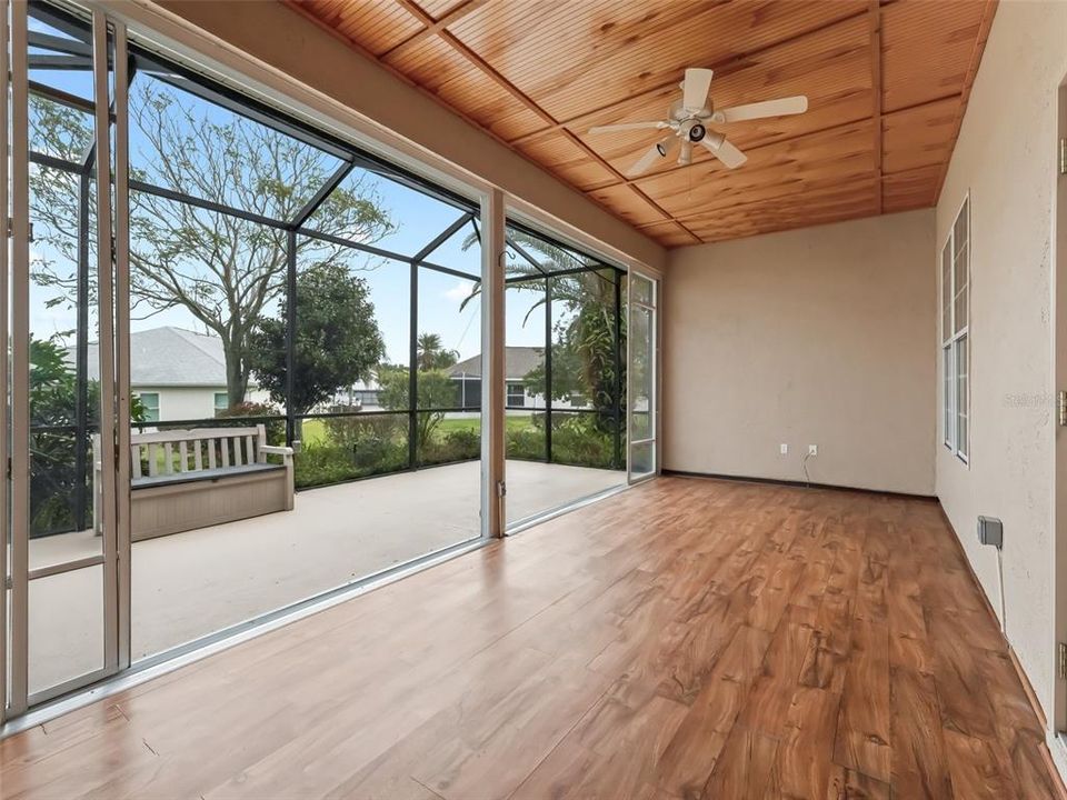 Enclosed lanai w/Bead board ceiling & laminate fl