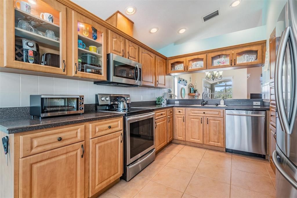 Updated kitchen accented with glass-front cabinets