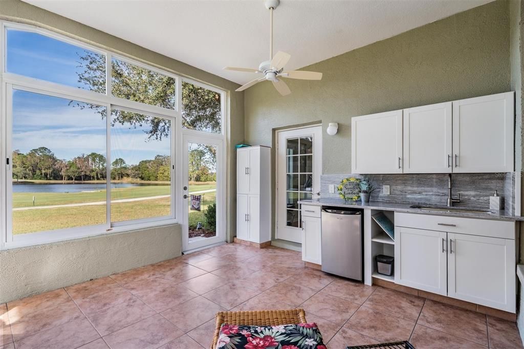 Easy-care tile lanai floor. Door provides access to the back of the home