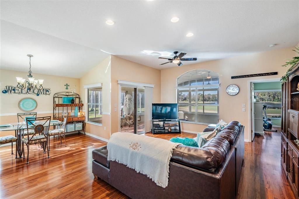 Living/dining area featuring high ceilings