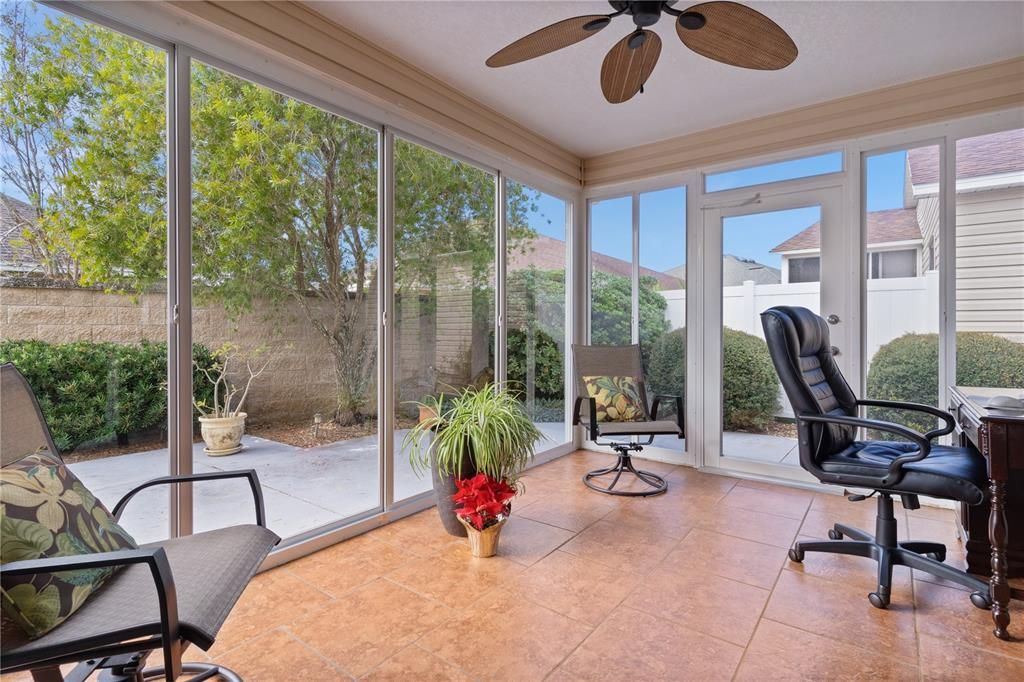 Lanai with Tiled Floor and Floor to Ceiling Sliding Glass Windows