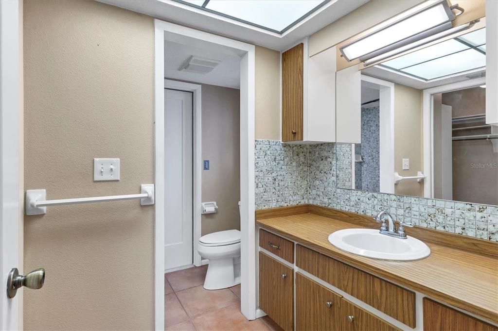 En-suite bath opens to the garage.