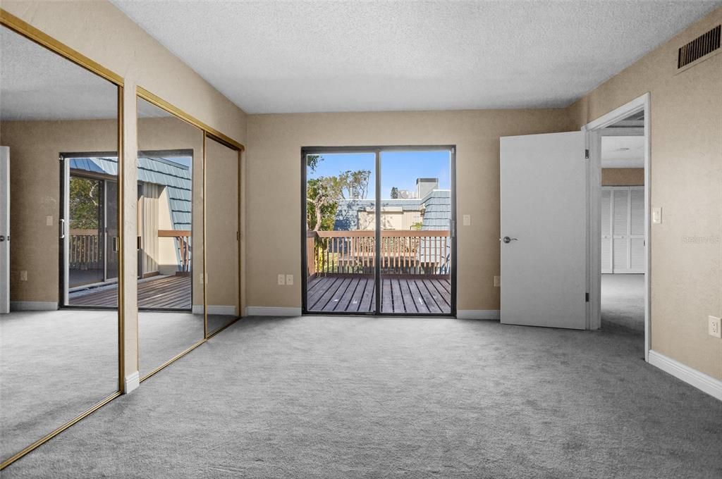 primary bedroom with adjoining bathroom