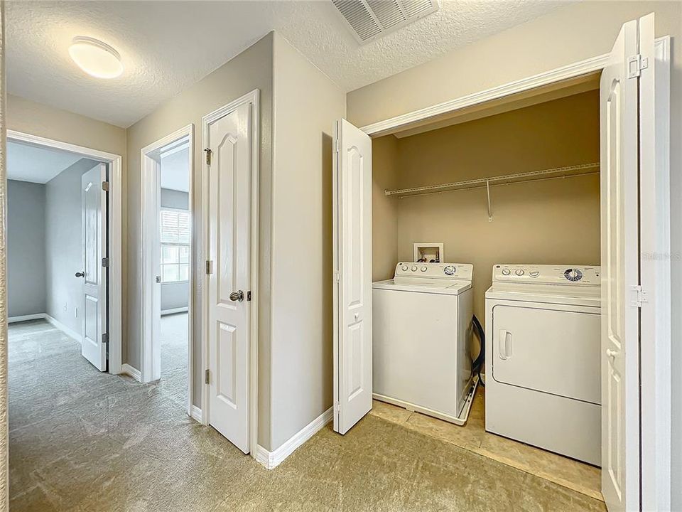 The washer and dryer are located conveniently upstairs.