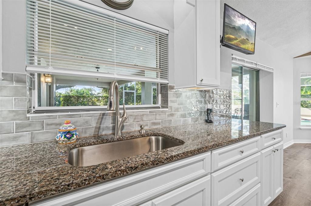 Granite Countertops w/Tile Backsplash & Window over Sink