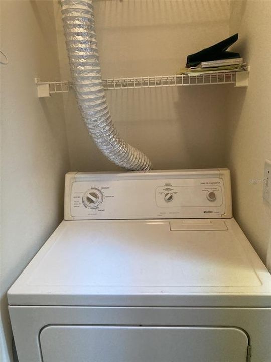 Dryer in laundry closet.