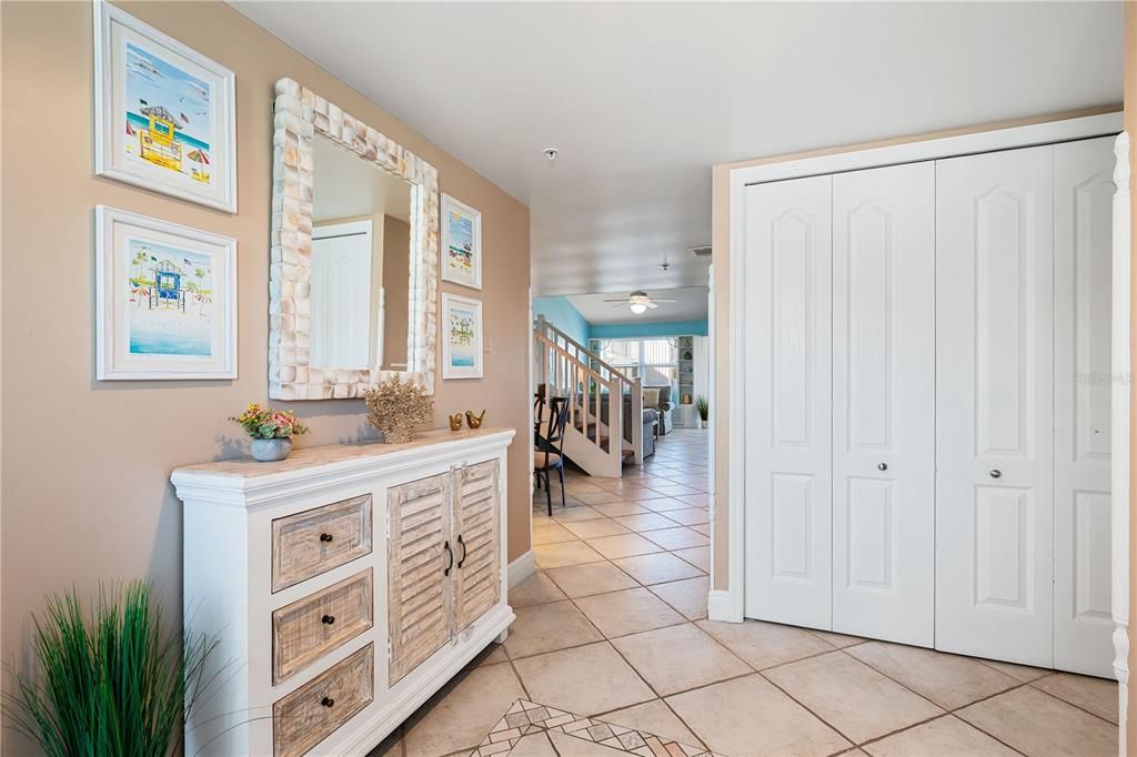 Interior front entrance. Inside the closet is the washer & dryer.