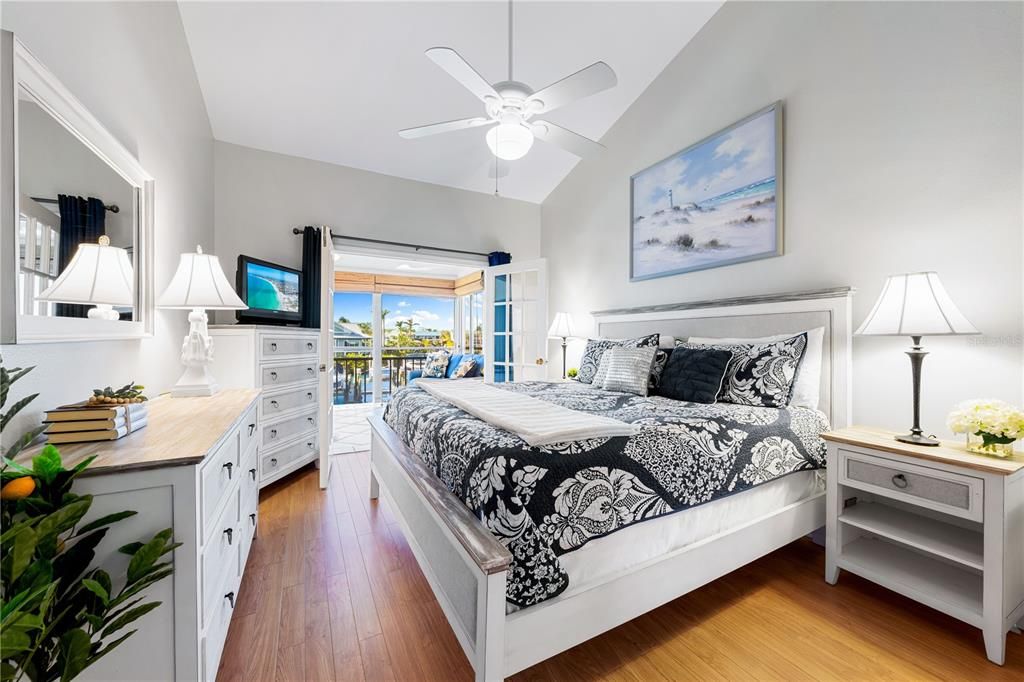 Primary bedroom with direct access to the Florida Room, through the glass french doors.