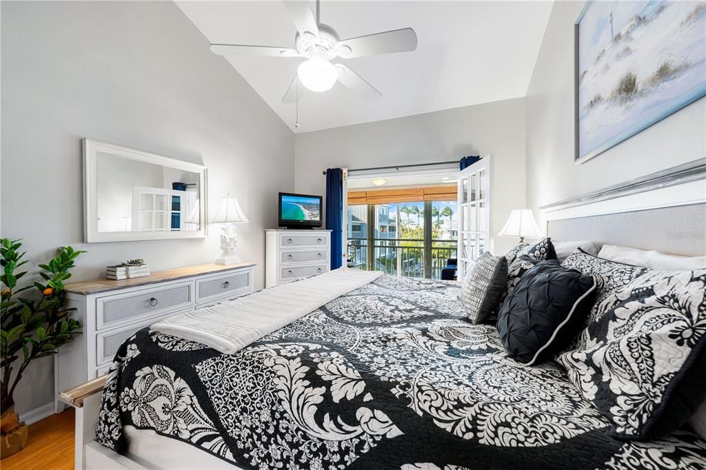 Primary bedroom with direct access to the Florida Room, through the glass french doors.