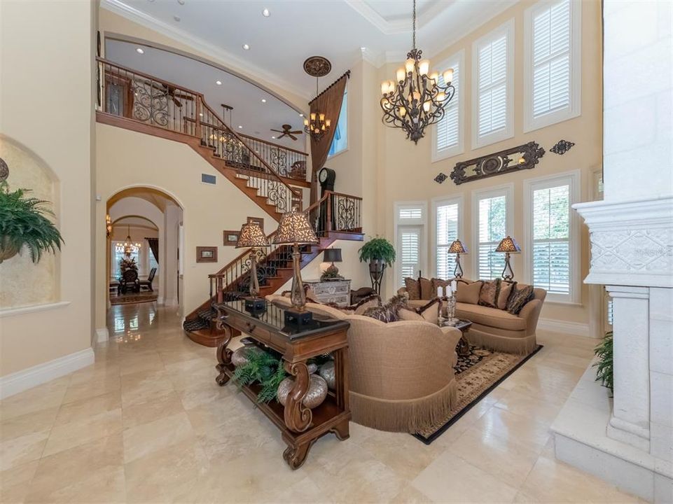 Formal living room with grand staircase