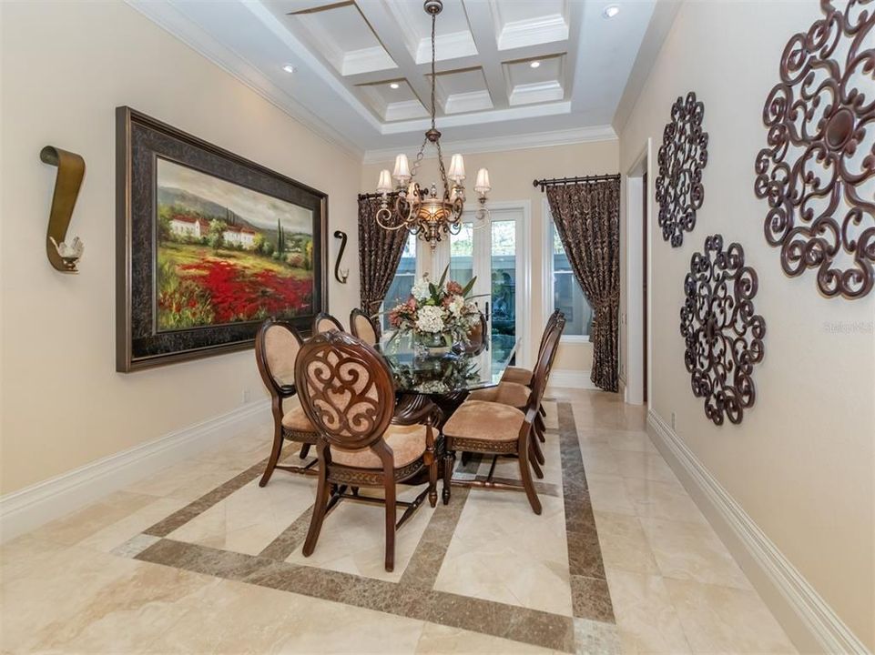 Dining room with double doors out to a garden patio