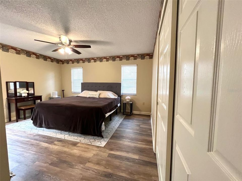 Master suite with laminate flooring